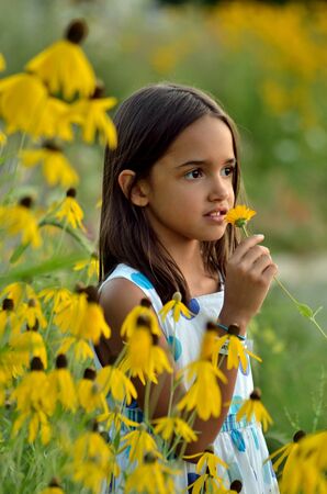 Little Hispanic Girl in the Gardenの写真素材
