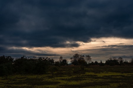 Stormy clouds over New Forest countrysideの写真素材