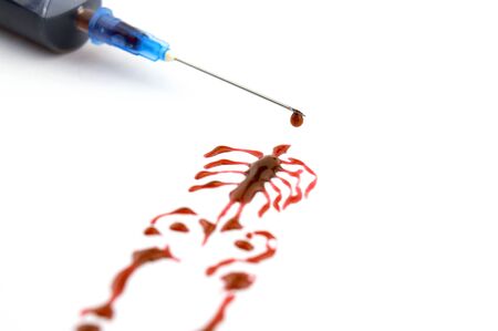 syringe with blood, silhouette of a manの写真素材