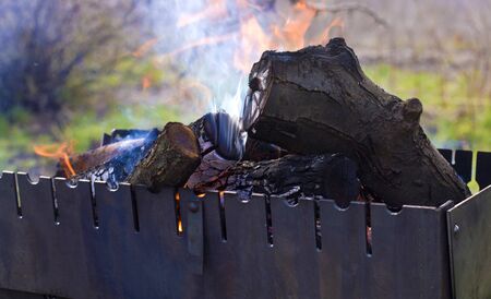 barbecue with heat on a background of green grassの写真素材