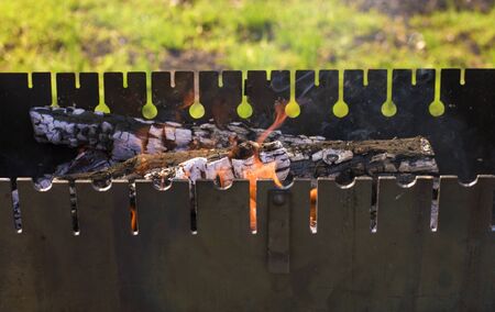 barbecue with heat on a background of green grassの写真素材