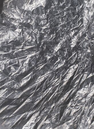 glossy polyethylene on a dark backgroundの写真素材