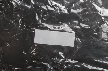 glossy polyethylene on a dark backgroundの写真素材