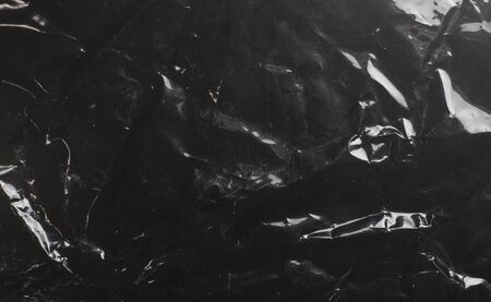 glossy polyethylene on a dark backgroundの写真素材
