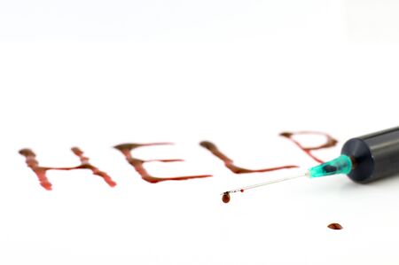 the word help, syringe with bloodの写真素材