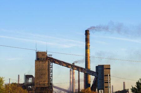 old chemical plant from pipes smoke