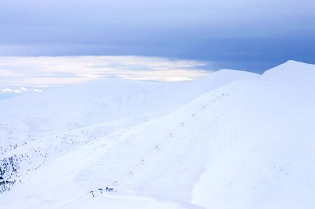 Highlands in winter are shrouded in snow.の写真素材