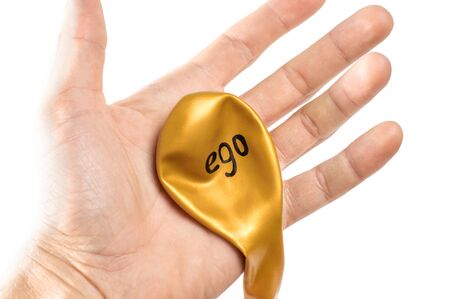 deflated balloon, the ego is written on the balloonの写真素材