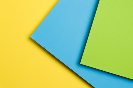 multicolored paper on a yellow backgroundの写真素材