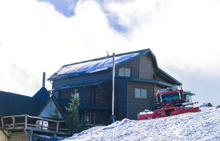 snowcat on the background of the house