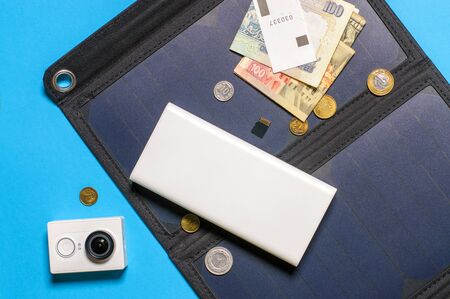 On the solar panel there is a money bank and a camera