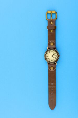 wrist watch on a blue backgroundの写真素材
