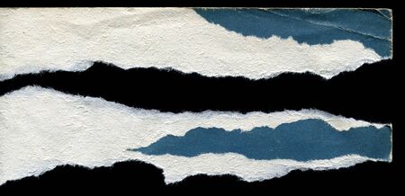 pieces of torn old paper on a black backgroundの写真素材