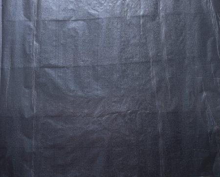 stretch film texture on a black backgroundの写真素材