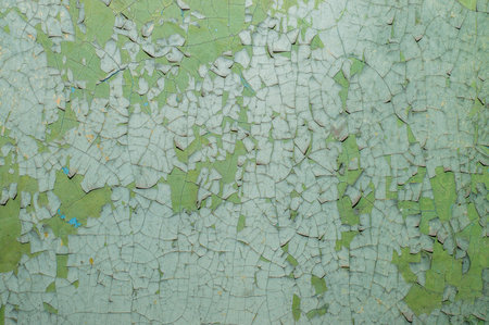Old painted wall with cracked paintの写真素材