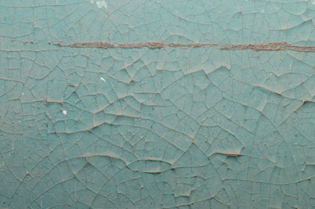 Old painted wall with cracked paint