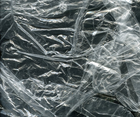 crumpled polyethylene texture on a dark backgroundの写真素材