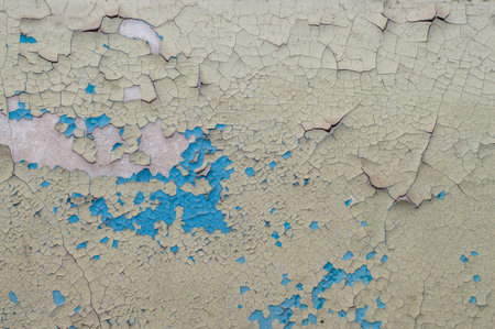 Old painted wall with cracked paintの写真素材