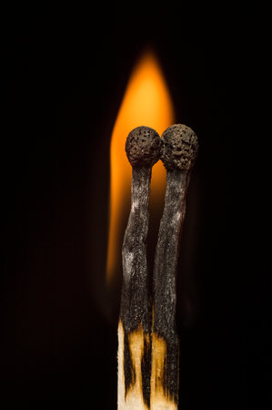 two matches on a black backgroundの写真素材