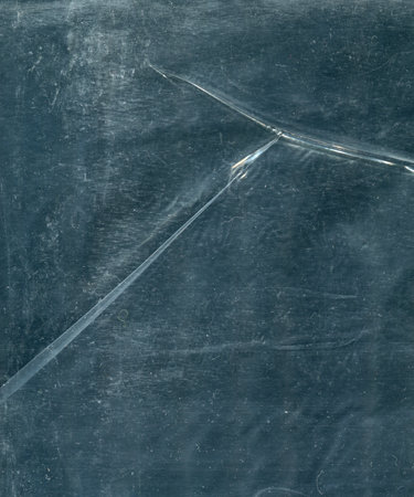 photo texture crumpled polyethylene of a dark shade of colorの写真素材