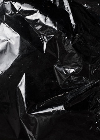 texture of dark crumpled polyethylene backgroundの写真素材