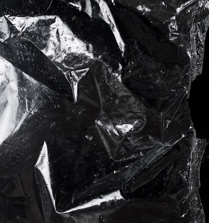 texture of dark crumpled polyethylene background
