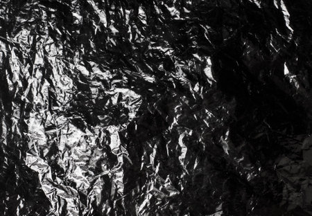 texture of dark crumpled polyethylene backgroundの写真素材