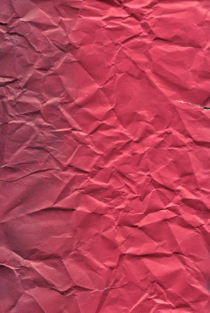 texture crumpled dark pink paper backgroundの写真素材