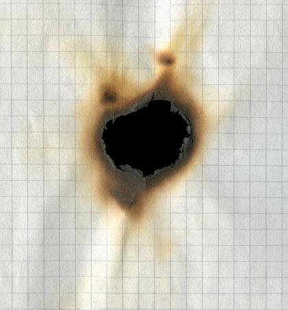 Texture of burnt checkered paperの写真素材