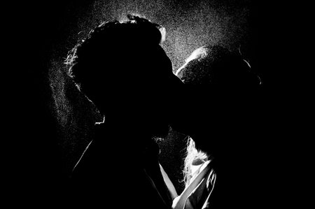 black and white silhouette of a kissing coupleの写真素材