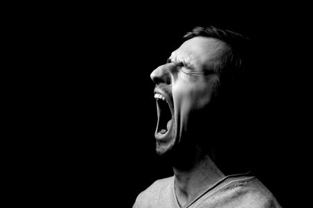 photo portrait of a guy on a black backgroundの写真素材