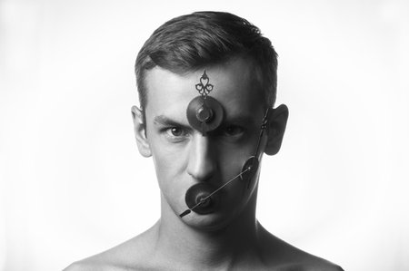 portrait of a guy, gears and clock hands on his faceの写真素材