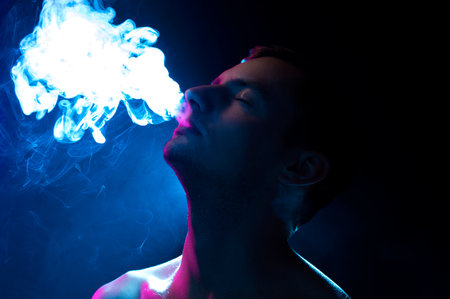 guy on a blue background with smoke