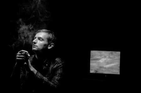 Noir photo guy smokes