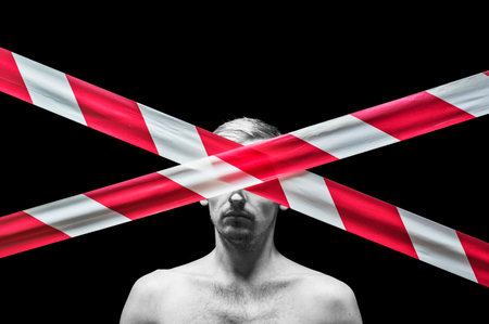 portrait of a guy, in the face a protective tapeの写真素材