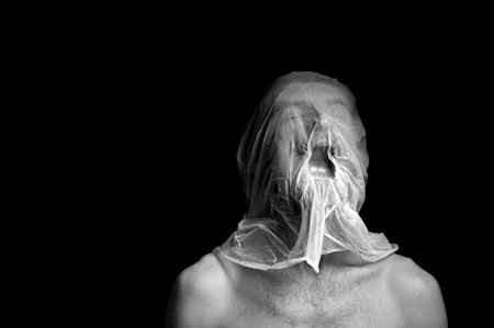 portrait strangulation, plastic bag on headの写真素材