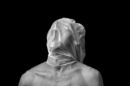portrait strangulation, plastic bag on headの写真素材