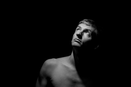 black and white dramatic photo of a man