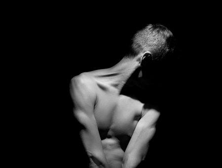 black and white dramatic photo of a manの写真素材