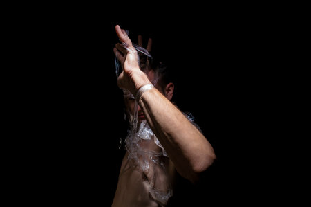 black and white photo, hands entangled in polyethyleneの写真素材