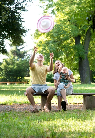 young family in the parkの写真素材