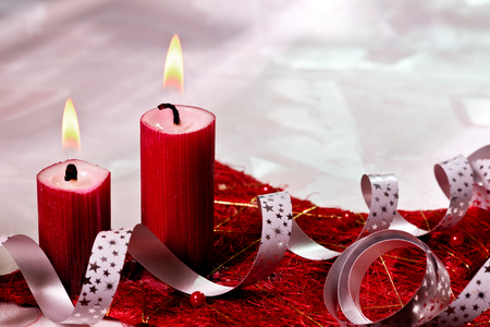 red christmas candles on the deskの写真素材