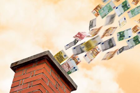 a lot of euros flies up the chimneyの写真素材