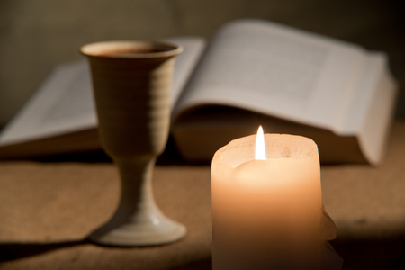 still life with bible and chalice ofwine の写真素材