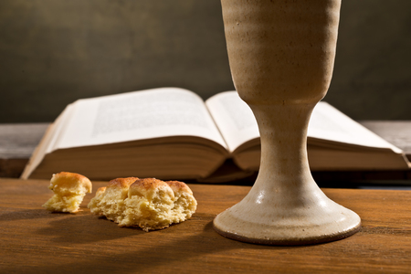 stil life with open bible and wine chaliceの写真素材