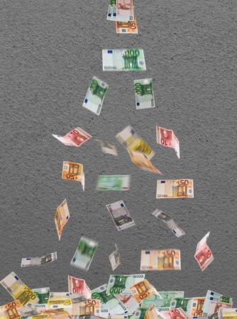 falling of euro currency on the gray backgroundの写真素材