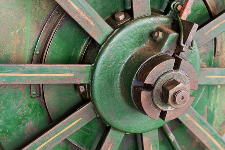 a detail of old rusty tractor wheel