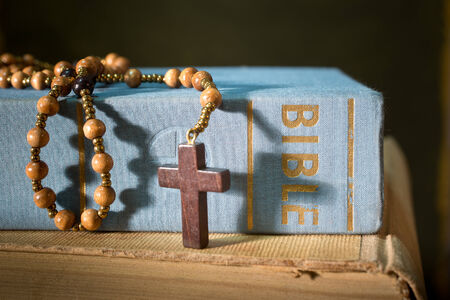 detail of bible with rosary on the tableの写真素材