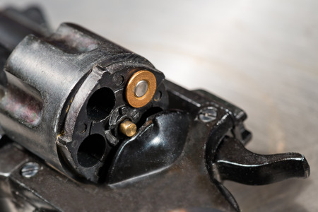 detail of a revolver with blank cartridgeの写真素材