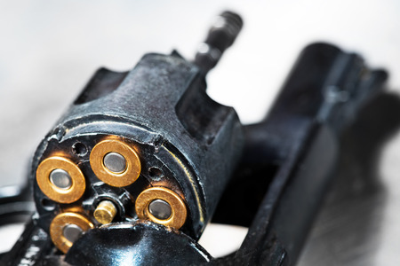 detail of a revolver with blank cartridgeの写真素材